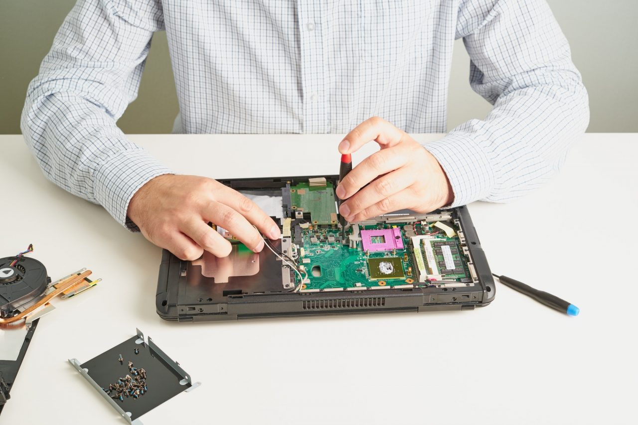 Man repairs computer.jpg